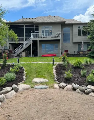 Backyard lake shore lawn maintenance