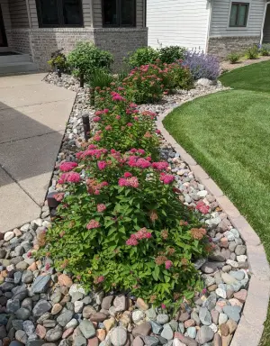 Flower rock beds by the driveway